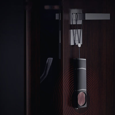 Obscura hanging on a door handle as a vibration alarm